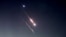 Sejumlah objek terlihat di langit di atas Yerusalem setelah Iran meluncurkan pesawat nirawak dan rudal ke arah Israel, di Yerusalem, 14 April 2024. (Foto: Reuters)