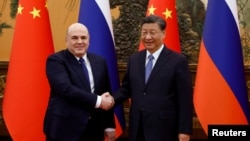 中国领导人习近平在北京会晤到访的俄罗斯总理米舒斯京(Mikhail Mishustin)。(2023年12月20日)