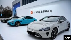 资料照片:中国电子产品公司小米在北京举行产品发布会,推出“小米SU7”电动车。(2024年3月28日)