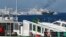 Kapal Garda Pantai China mengerahkan meriam ke arah kapal Unaizah yang disewa oleh militer Filipina untuk membawa pasokan ke beting Second Thomas Shoal di Laut China Selatan, 5 Maret 2024. (Foto: Jam Sta Rosa/AFP)