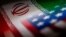 Bendera Iran dan AS terlihat berdampingan dalam sebuah ilustrasi. AS akan segera memberlakukan sanksi baru terhadap program rudal dan pesawat tak berawak atau drone Iran setelah Teheran menyerang Israel. (Foto: REUTERS/Dado Ruvic)