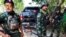 FILE - Tentara Tentara Pembebasan Nasional Karen (KNLA) bersiap untuk berpatroli di Myawaddy, kota perbatasan Thailand-Myanmar di bawah kendali koalisi pasukan pemberontak yang dipimpin oleh Persatuan Nasional Karen, di Myanmar, 15 April 2024. (REUTERS/Athit Perawongmetha)