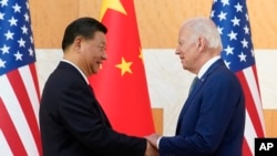 资料照片:美国总统拜登2022年11月14日与中国国家主席习近平在印尼20国峰会外围举行面对面会谈。