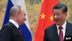 资料照:中国领导人习近平在北京会晤到访的俄罗斯总统普京。(2022年2月4日)