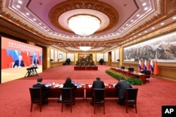 中国领导人习近平在北京与俄罗斯总统普京举行视频会谈。(2022年12月30日)