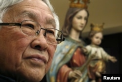 香港天主教会前任枢机主教,86岁的陈日君2018年2月9日在中国香港出席新闻发布会。