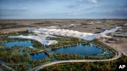 Gambar rencana pembangunan Bandara Internasional Al Maktoum Dubai dipamerkan di Dubai World Central,Dubai, Uni Emirat Arab. Pemerintah Dubai mengumumkan dimulainya pembangunan terminal bandara terbesar di dunia, Minggu, 28 April 2024. (Foto: Pemerintah Dubai via AP)
