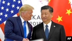 资料照片:美国总统特朗普和中国国家主席习近平在大阪G20峰会期间会晤。(2019年6月29日)