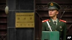 A Chinese paramilitary policeman stands guard outside of the North Korean Embassy in Beijing, April 20, 2017.