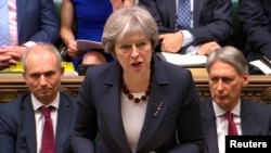 英国首相特蕾莎·梅在英国议会下院宣布对俄罗斯的报复措施。(2018年3月14日)