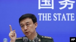 中国国防部发言人吴谦在北京中国国务院举行的记者会上(2019年7月24日)