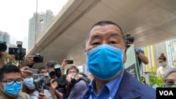 壹传媒创办人黎智英参与2019年六四烛光集会,被控"参与未经批准集结",2021年11月1日在区域法院维持不认罪(美国之音汤惠芸)